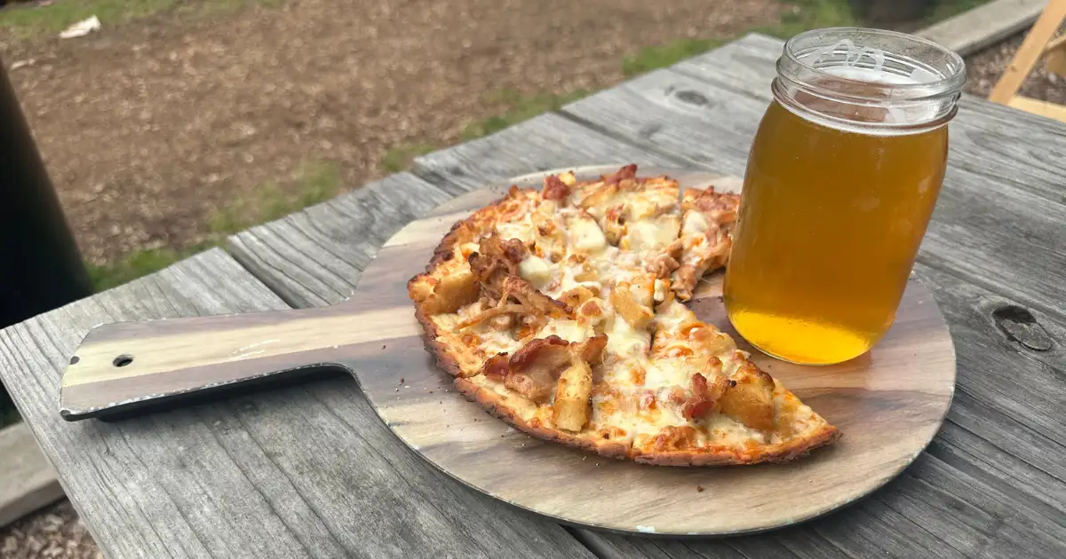 Image of pizza and beer from Bad Martha's Farmers Brewery in East Falmouth, Massachusetts. This is one of the Massachusetts breweries with food.